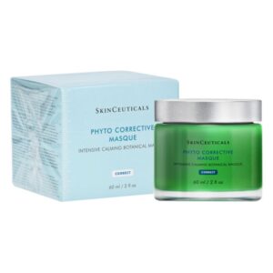 Eine grüne Maske in einem Glasbehälter neben einer blauen Verpackung, beide von SkinCeuticals, für beruhigende Hautpflege.