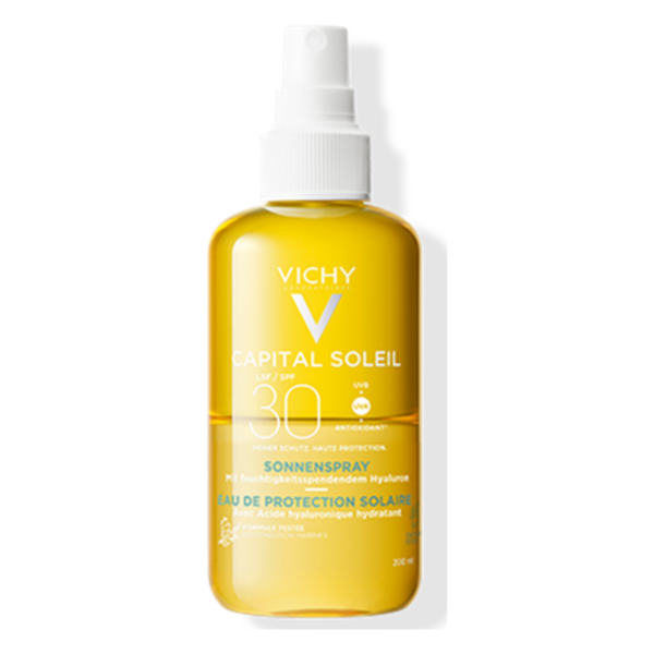 Transparente Sprühflasche mit Sonnenschutzmittel von Vichy, LSF 30, angereichert mit Hyaluronsäure.