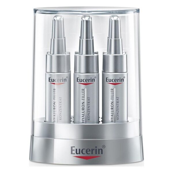 Drei silberne Eucerin Hyaluron-Filler Konzentrate im transparenten Verpackungsständer.