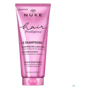 Rosa Tube mit Shampoo von NUXE, das für Glanz und vegane Formel bewirbt.