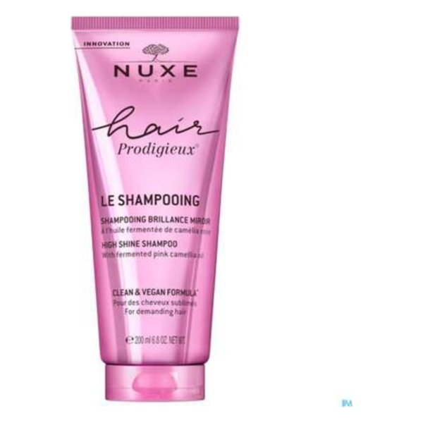 Rosa Tube mit Shampoo von NUXE, das für Glanz und vegane Formel bewirbt.