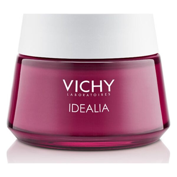 Vichy Idealia Gesichtscreme in einem runden, lila Glasbehälter mit weißem Deckel.