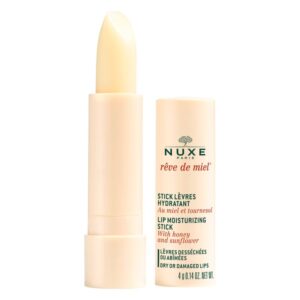 Lip Balm von Nuxe in einem beige-farbenen Stick mit Aufschrift und herausgedrehter Spitze.