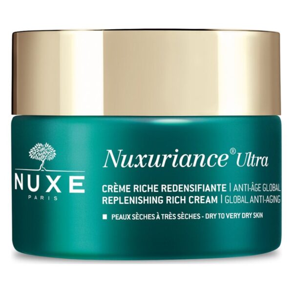 Grüne Creme-Dose mit goldfarbenem Deckel, beschriftet mit Nuxuriance Ultra und Hinweisen zur Anwendung.