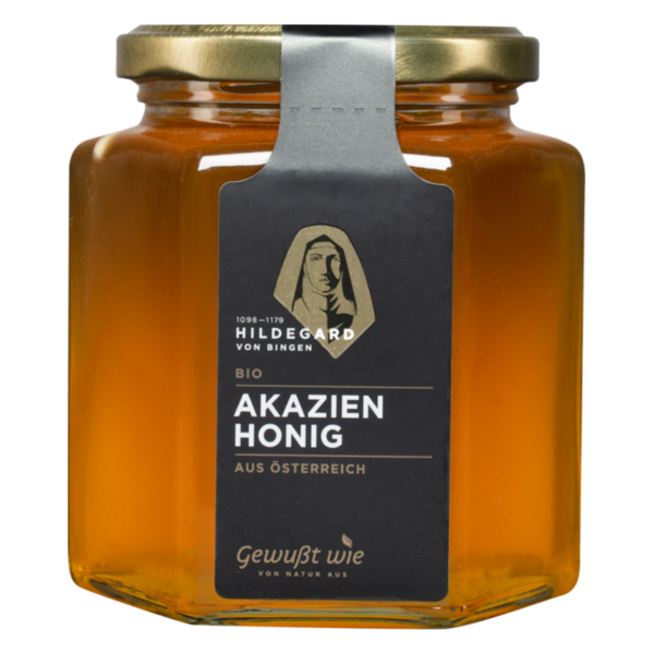 Glasbehälter mit goldenen Verschluss, gefüllt mit Bio-Akazienhonig, Etikett zeigt Hildegard von Bingen und Herkunft Österreich.