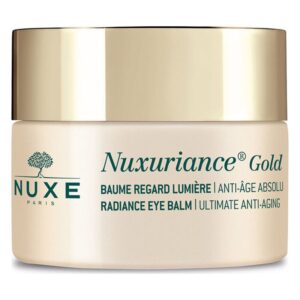 Goldfarbener Deckel auf einem hellen Tiegel mit der Aufschrift "Nuxuriance Gold Radiance Eye Balm".