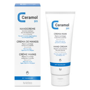 Eine Handcreme in einer weißen Tube mit blauer Schrift und einem Karton, der die Anwendung für empfindliche Haut beschreibt.