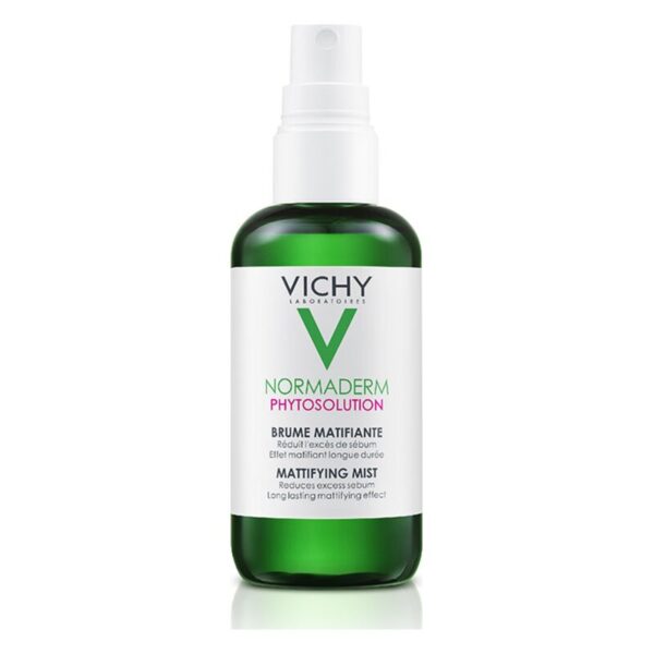 Grüne Flasche mit einem weißen Etikett und Sprühkopf, enthält mattierende Gesichtsspray von Vichy.