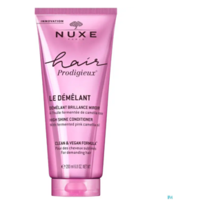 Rosa Tube eines Haarconditioners mit der Aufschrift "Démêlant Brillance Miroir" und veganer Formel.