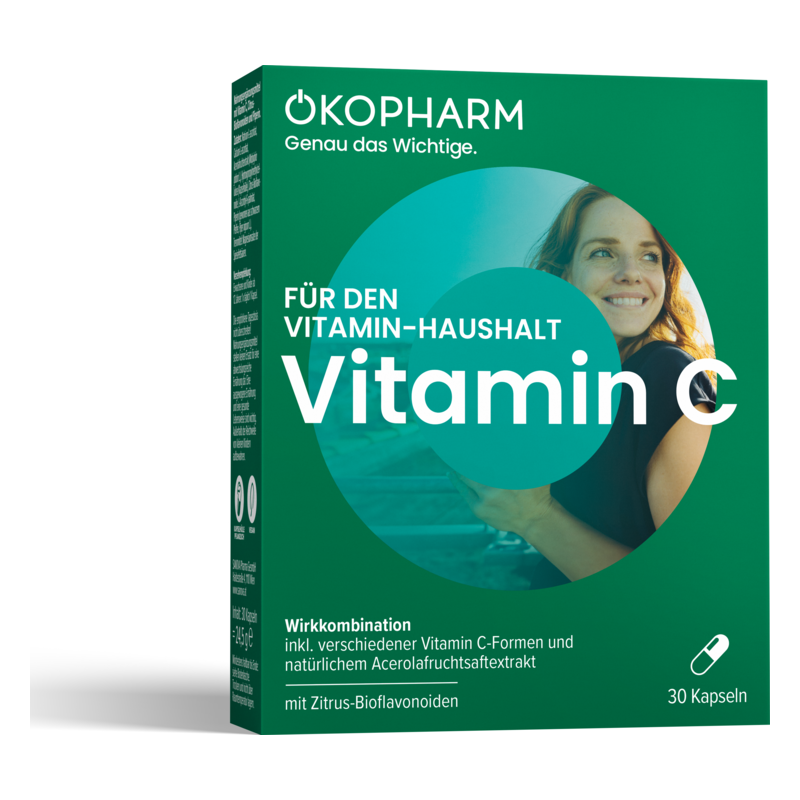 Verpackung mit der Aufschrift "Vitamin C" und einer Frau, die lächelt, auf grünem Hintergrund.