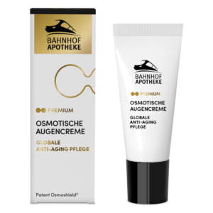 Verpackung und Tube einer osmotischen Augencreme der Marke Bahnhof Apotheke, gold-weißer Aufdruck, Anti-Aging Pflege.