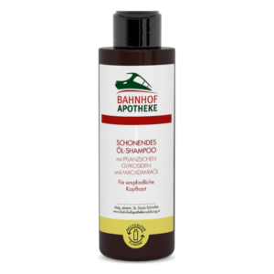 Flasche mit schützendem Öl-Shampoo für empfindliche Kopfhaut, inklusive Inhaltsstoffen wie Macadamiaöl.