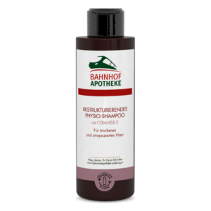 Flasche mit restrukturierendem Physio-Shampoo von Bahnhof Apotheke, geeignet für trockenes und strapaziertes Haar.