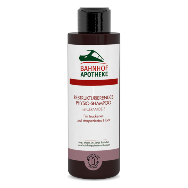 Flasche mit restrukturierendem Physio-Shampoo von Bahnhof Apotheke, geeignet für trockenes und strapaziertes Haar.