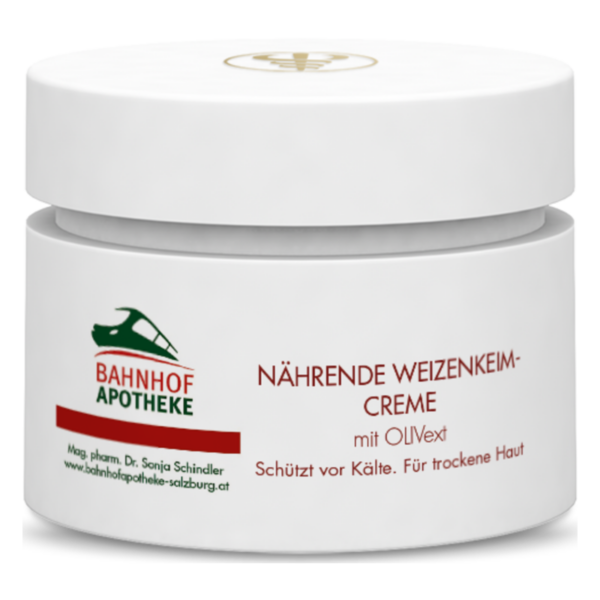 Weißes Cremetöpfchen mit rotem Schriftzug 'NÄHRENDE WEIZENKEIM-CREMÉ'. Schützt vor Kälte, für trockene Haut.