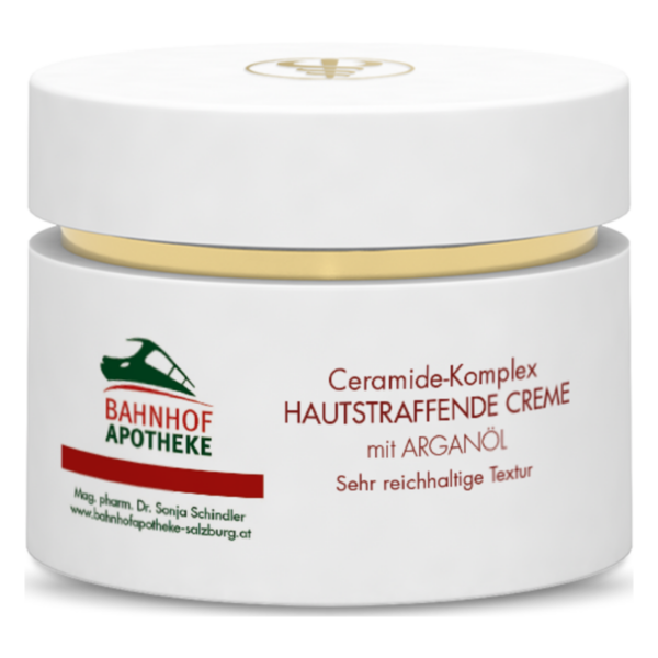 Weißer Cremetiegel mit goldfarbenem Deckel, beschriftet mit "Ceramide-Komplex HAUTSTRAFFENDE CREME" und Logo der Bahnhof Apotheke.